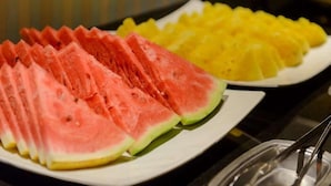 A plate of watermelon slices and pineapple chunks. - San Hua Hotel (Kaohsiung)