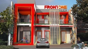 A modern building with a red and white facade, labeled "FRONTONE cabin." - Front One Cabin Malioboro Jogja (Yogyakarta)