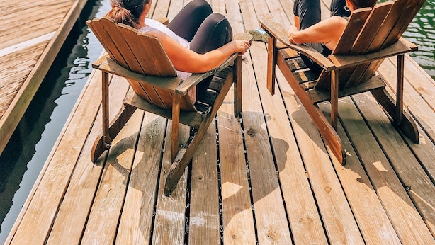 Two wooden chairs on a dock with a calm lake and trees in the background. - Lakefront Event Venue: Wedding -Reunions -Retreats (Cedar Mountain)