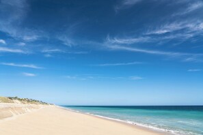 A beach with clear skies and calm waters. - Zadun, a Ritz-carlton Reserve (San José del Cabo)