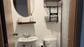 Shower, towels, soap, toilet paper