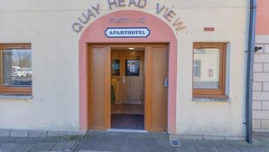 A building labeled "Quay Head View Flats 1-12" with an "Apart Hotel" sign. - Quay Head View (Stranraer)