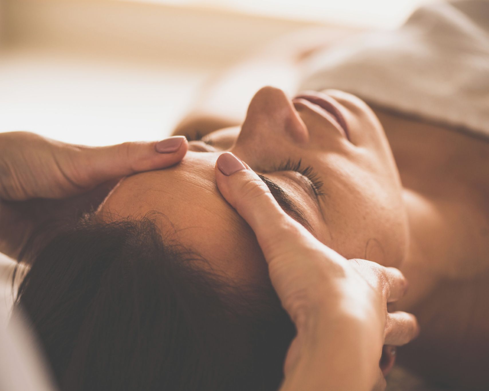 A close-up of a person receiving a massage.