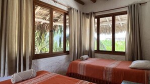 A room with two beds, a ceiling fan, and windows with curtains. - Ensueno Holbox & Beach Club (Isla Holbox)