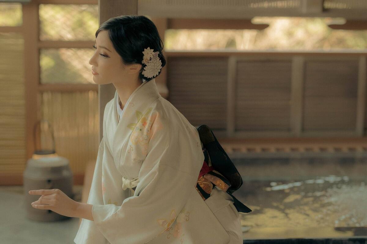 A traditional Japanese interior with tatami flooring and a wooden structure.