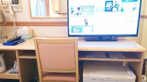 A small office with a computer, a chair, a desk, a printer, and a hair dryer on the wall. - Toyoko INN Kokura-eki Shinkansen-guchi (Kitakyushu)