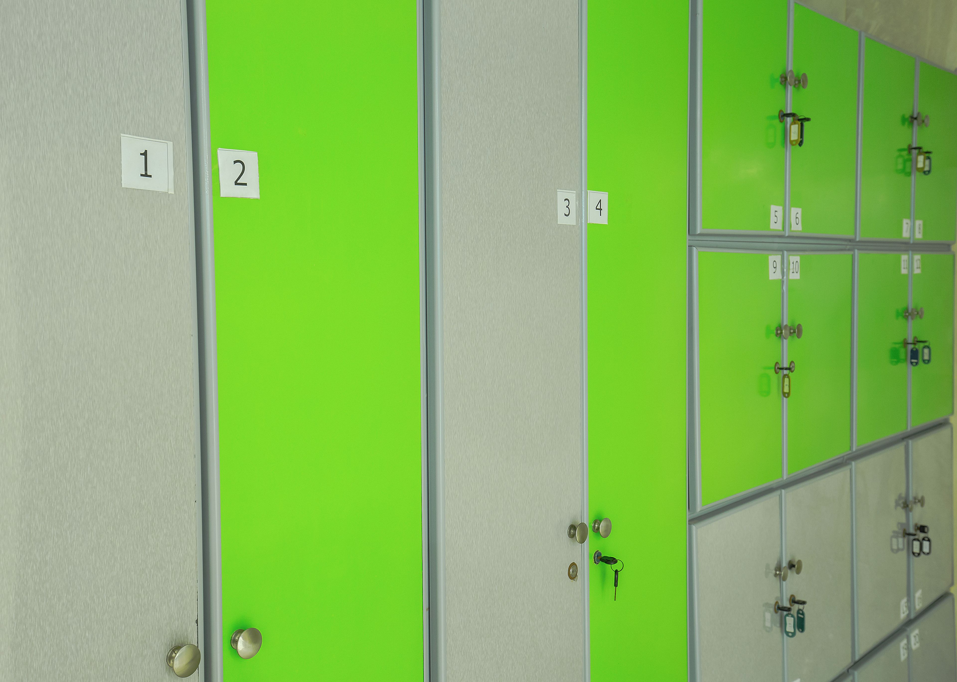 A row of lockers with numbered labels from 1 to 10.