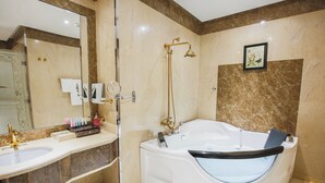 A bathroom with a bathtub, a shower, a sink, and a large mirror. - Rest Night Hotel Suites Al Hamra (Riyadh)