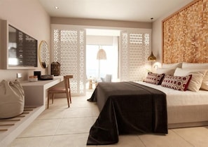 A modern bedroom with a bed, bedside table, chair, and a TV mounted on the wall. - Marbella Elix (Igoumenitsa)
