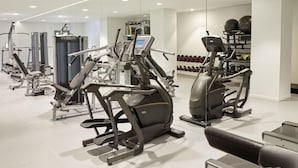 A modern gym with various exercise machines, weight racks, and dumbbells. - Marbella Elix (Igoumenitsa)