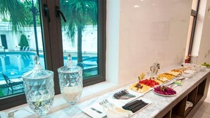 A breakfast buffet with various food items and condiments. - Vela Luxury Hai Ha Hotel  (Quang Ha)