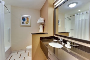 A modern bathroom with a large mirror, a sink, a toilet, and a shower. - Fairfield Inn Suites Dunn I 95 (Dunn)