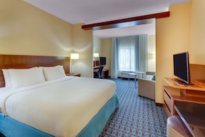 A hotel room with a large bed, a desk, a chair, a TV, and a window with curtains. - Fairfield Inn Suites Dunn I 95 (Dunn)