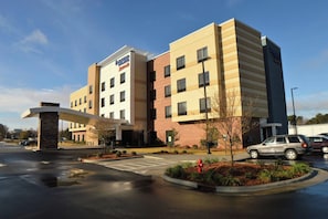 A hotel with a clear entrance, a parking lot, and a Marriott sign. - Fairfield Inn Suites Dunn I 95 (Dunn)