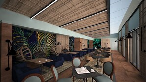 A modern interior with blue sofas, wooden tables, and a ceiling with exposed beams and lighting. - Ores Boutique Hotel (Bansko)