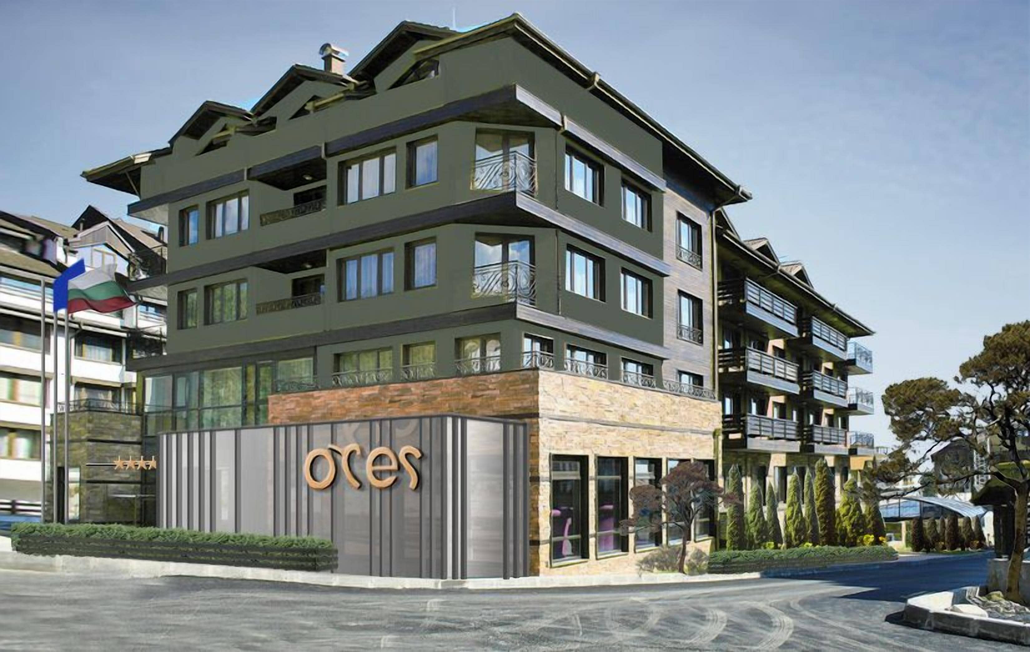 A multi-story hotel with a modern design, featuring balconies and large windows.