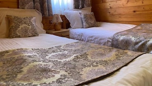 A wooden cabin room with two beds, a nightstand, and a window with curtains. - Alpin (Samokov)