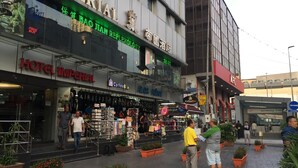 A hotel with a sign reading 'HOTEL IMPERIAL' and a visible storefront with various shops. - Hotel Imperial (Kuala Lumpur)