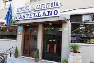 The exterior of Hotel Castello with a sign indicating a cafeteria.