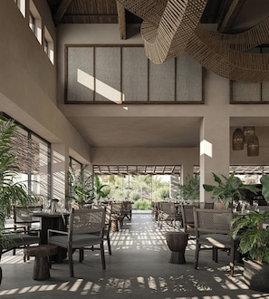 A spacious indoor area with high ceilings, large windows, and multiple seating arrangements. - Aldiana Club Costa del Sol (La Línea de la Concepción)