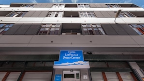 Hotel Las Palmas Urban Center with a modern facade, large windows, and a prominent sign. - Hotel Las Palmas Urban Center (Las Palmas de Gran Canaria)
