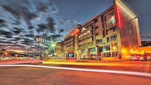 A multi-story hotel with a prominent sign on the facade. - New Hotel Nampula (Nampula)