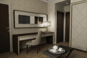 A hotel room with a desk, chair, and a tray with teapot and cups. - Menelaion (Sparta)