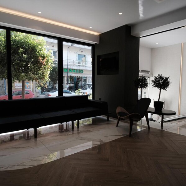 A modern interior with a bench, a chair, and a potted plant. - Park (Larissa)