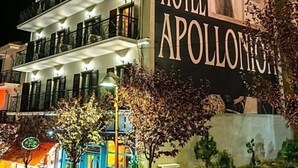 A multi-story building with a large sign for the City Hotel Apollonia. - City Hotel Apollonion (Karpenisi)