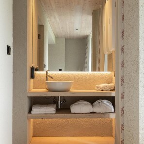 A bathroom with a white sink, a mirror, and a towel rack. - Bohinj (Bohinj)
