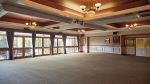 A large, open room with high ceilings, chandeliers, and large windows. - The Farmhouse Innlodge (Portsmouth)