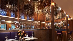 A restaurant with a bar area, purple seating, and a decorative ceiling. - Fingal A Luxury Floating Hotel (Edinburgh)