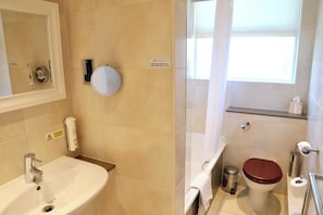 A bathroom with a sink, mirror, toilet, and a window. - Classic Lodges Farington Lodge (Leyland)