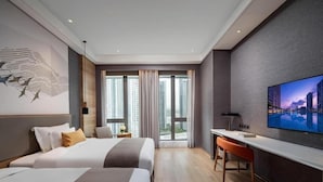 A hotel room with two beds, a desk, a TV, and a large window with curtains. - Genpla Hotel Shenzhen Nanshan (Shenzhen)