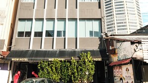 A hotel with a modern facade, multiple floors, and a prominent awning with the hotel's name. - Palette Georgetown Formerly WoW Hotel (George Town)