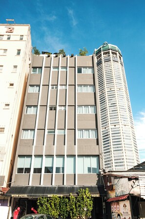 A hotel with a modern facade, multiple floors, and a prominent awning with the hotel's name. - Palette Georgetown Formerly WoW Hotel (George Town)