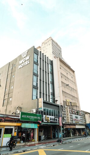 A hotel with a modern facade, multiple floors, and a prominent sign. - Palette Georgetown Formerly WoW Hotel (George Town)