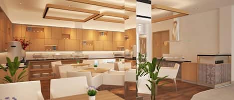 A modern hotel lobby with a central seating area, a reception desk, and a kitchen in the background.