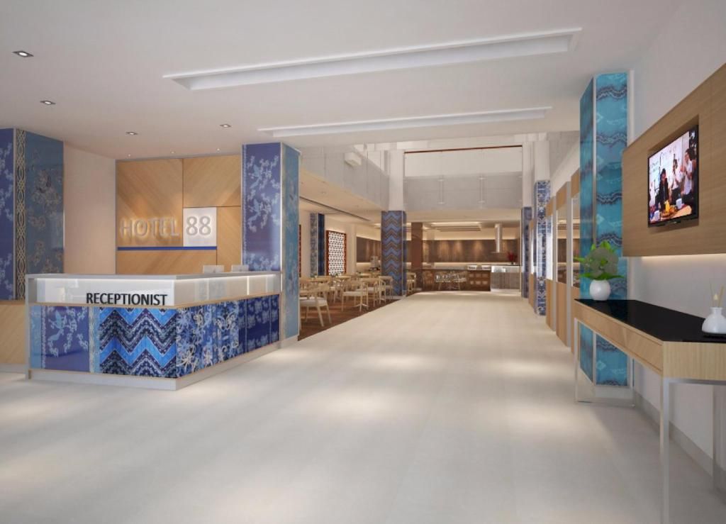 A hotel reception area with a reception desk labeled 'HOTEL 88,' a television mounted on the wall, and a seating area with tables and chairs.