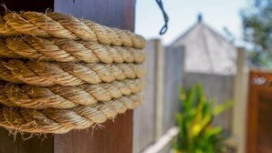 A close-up of a rope tied around a wooden post. - Blue Lagoon Avia Villas (Ceningan Island)