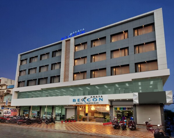 A multi-story hotel with a prominent sign for 'Anaya Beacon Hotel - Jamnagar.' - Anaya Beacon Hotel (Jamnagar)