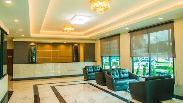 A lobby with a seating area, large windows, and a chandelier. - Atk Hatyai Hotel (Hat Yai)