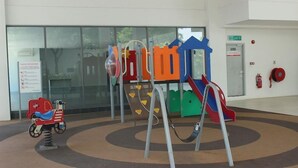 A children's play area with a slide and climbing structures. - Sunset & Seaview Vacation Condo City Centre @ Imago Shopping Mall (Kota Kinabalu)
