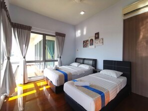 A hotel room with two beds, a large window with curtains, and wall art. - Sunset & Seaview Vacation Condo City Centre @ Imago Shopping Mall (Kota Kinabalu)