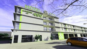 A multi-story hotel with a modern design, featuring a prominent sign with the price '49€' and the name 'HOTEL A PARIS'. - B&B Hotel Perpignan Saleilles (Saleilles)