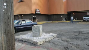 A building with a large sign reading "The Vegas Casino" and a parking lot with a car and a person walking. - Americas Best Value Inn Billings (Billings)