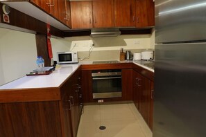 Private kitchen - Huon Gulf Hotel and Apartments (Lae)