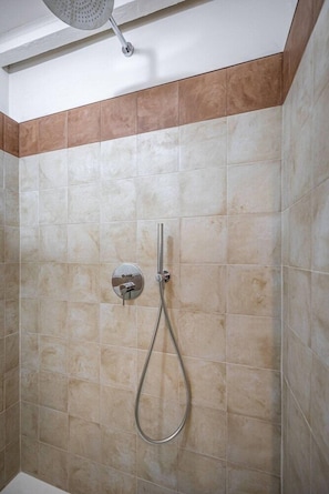 A shower with a handheld showerhead and a wall-mounted control panel. - Flospirit - Viola (Florence)