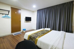 A hotel room with a bed, a television, a door, and a curtain. - Hotel Sunjoy9 MID Valley (Kuala Lumpur)