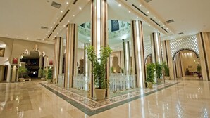 A spacious lobby with high ceilings, large columns, and a polished floor. - Sunny Days Palma De Mirette Resort (Hurghada)